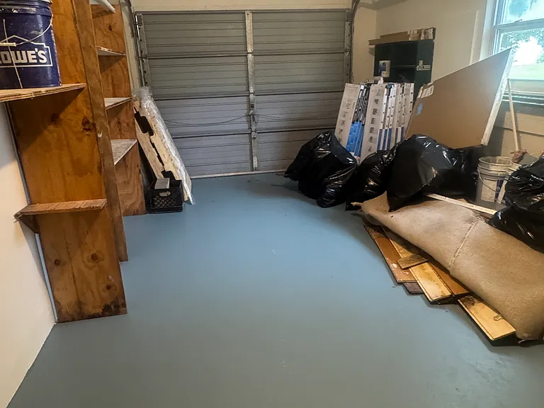 garage with shelving (still to be cleaned out)