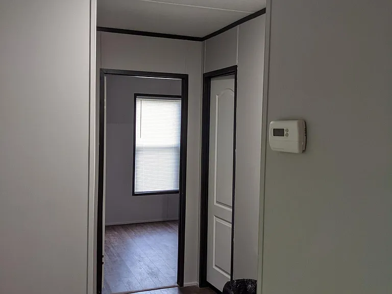 Hallway to secondary bedrooms, hall bath and laundry nook