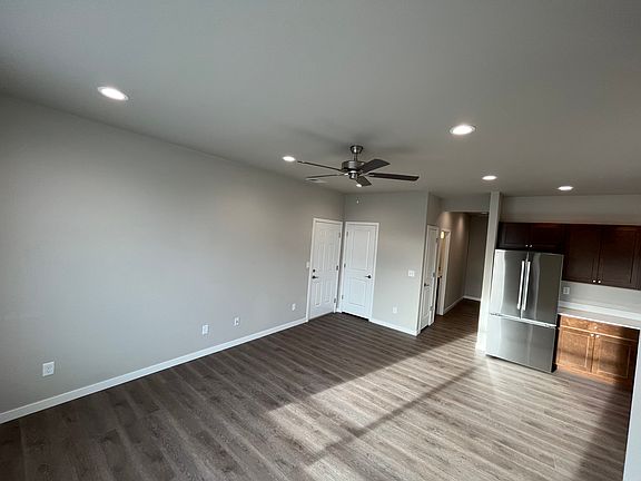 Another view of the living room/kitchen. Coat closet in far corner near entrance