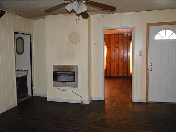 Dining Room with Hardwood Floors and Front Door.  There is a Half Bath off of this room.