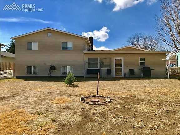 Rear view of property, large fenced yard