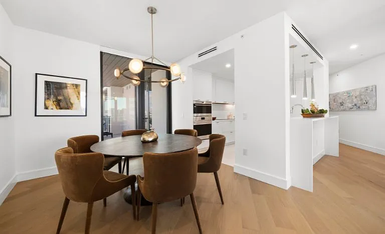 Sky Residence D kitchen & dining area, elegantly furnished with the Restoration Hardware package.