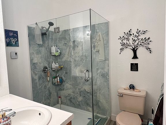 Bathroom

Beautiful aqua-blue tile four-foot shower, nine-foot high storage shelves, and a four-foot vanity with multiple drawers