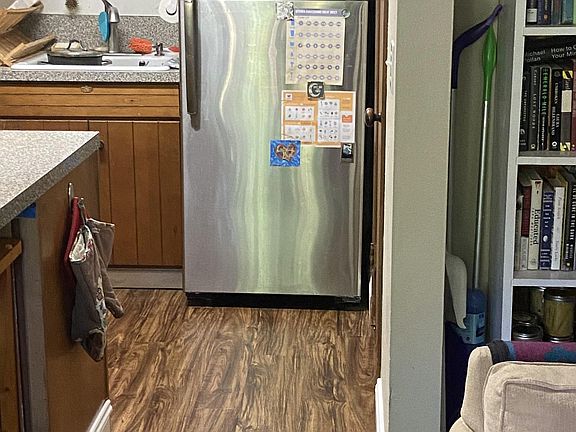 Kitchen with large, stainless steel fridge