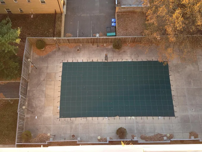 The unit's balcony overlooks the pool