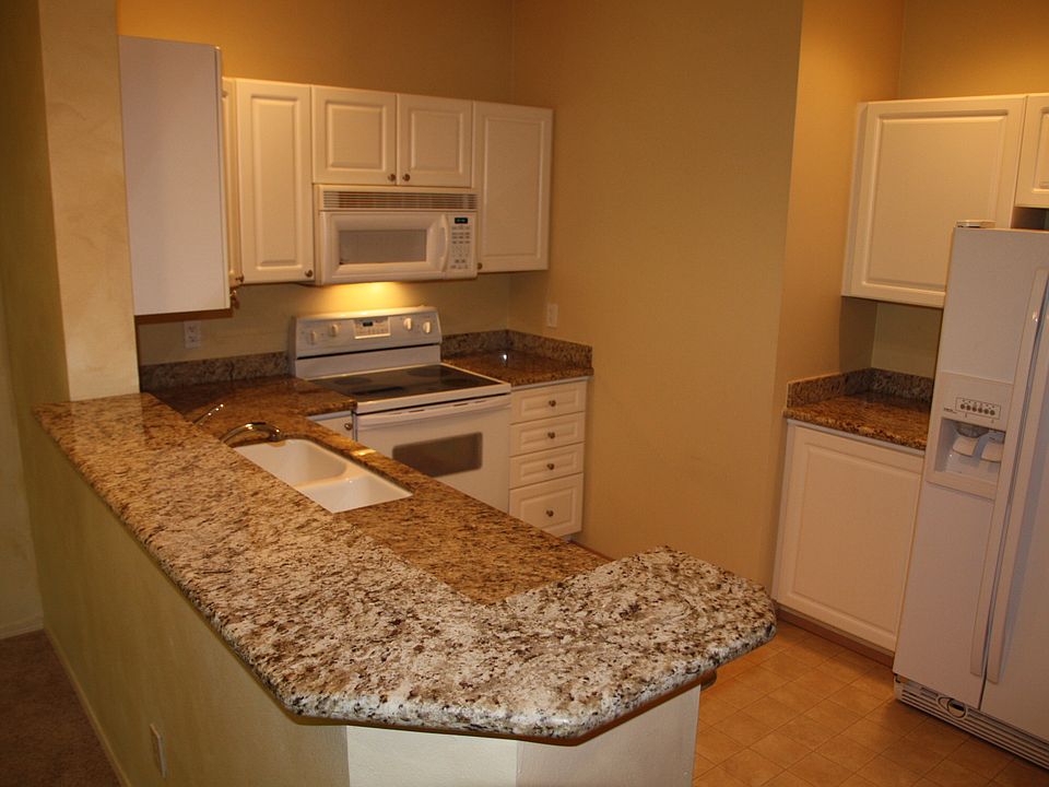 Kitchen with Granite Slab Counters