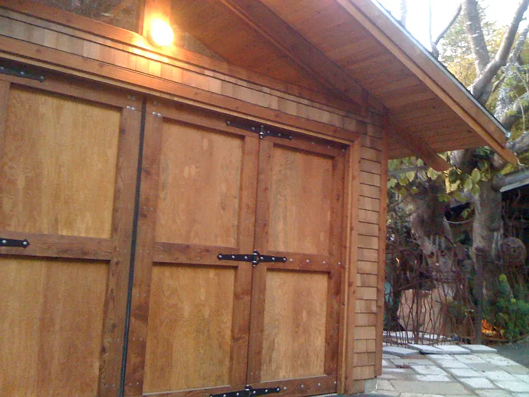 Front (eastern) elevation of building housing the Garden apartment. Shared large gate provides security and privacy from street