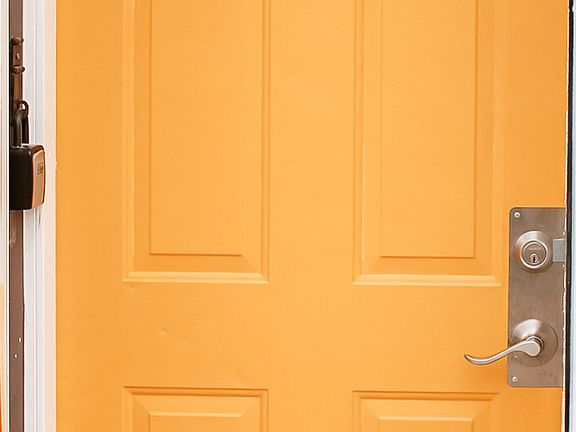 Bright front door to welcome you and your guest, opens to stairs going up to unit.