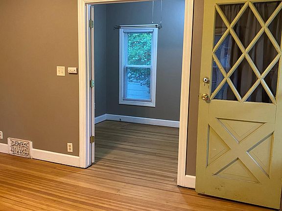 living room looking into main floor bedroom