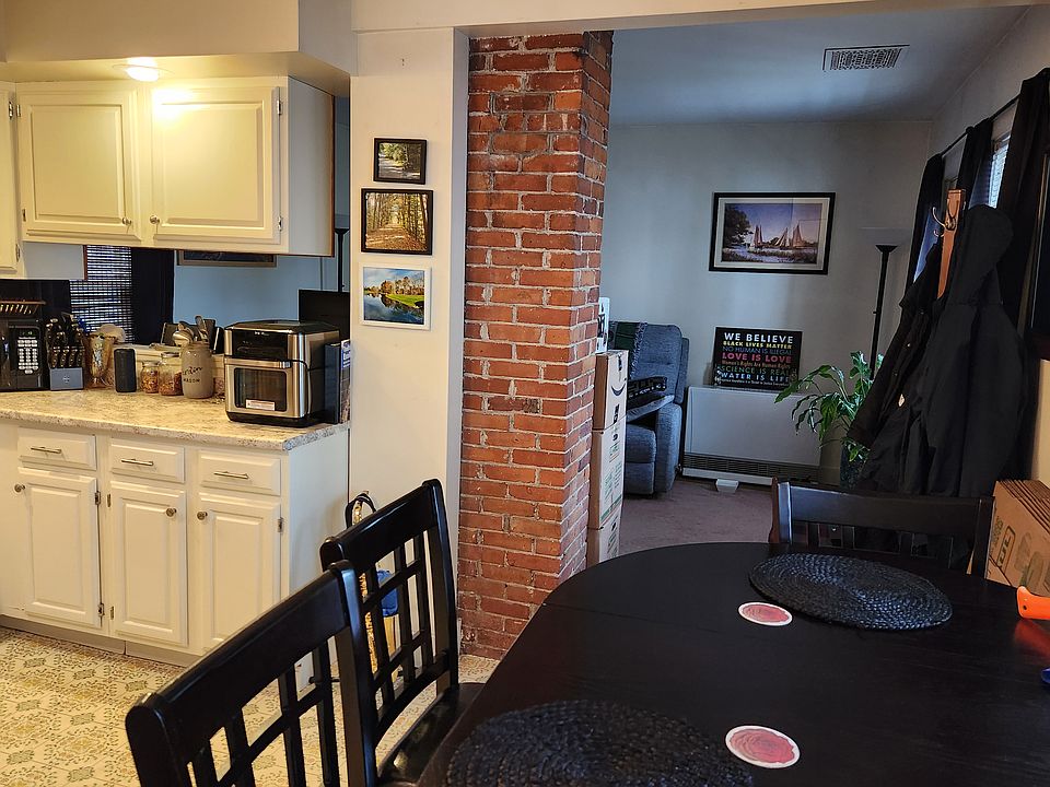 Spacious eat-in kitchen that looks into livingroom.