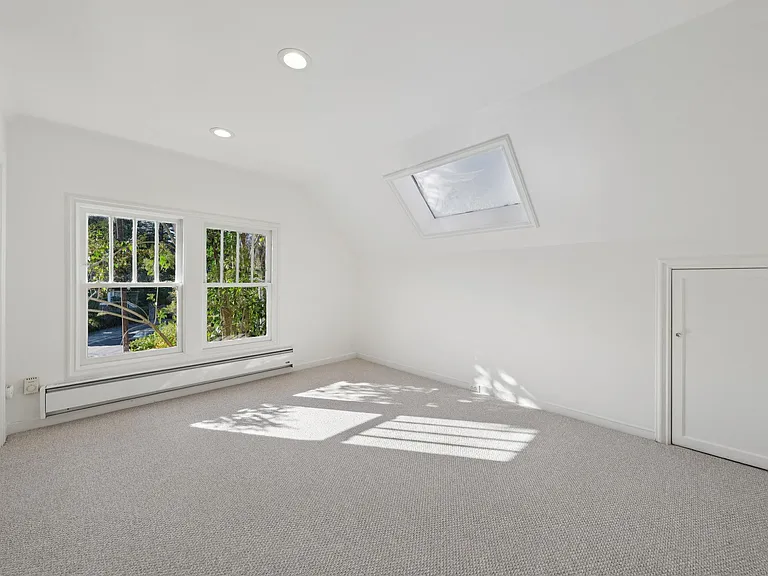 Bedroom #3 with skylight, built in drawers and closet