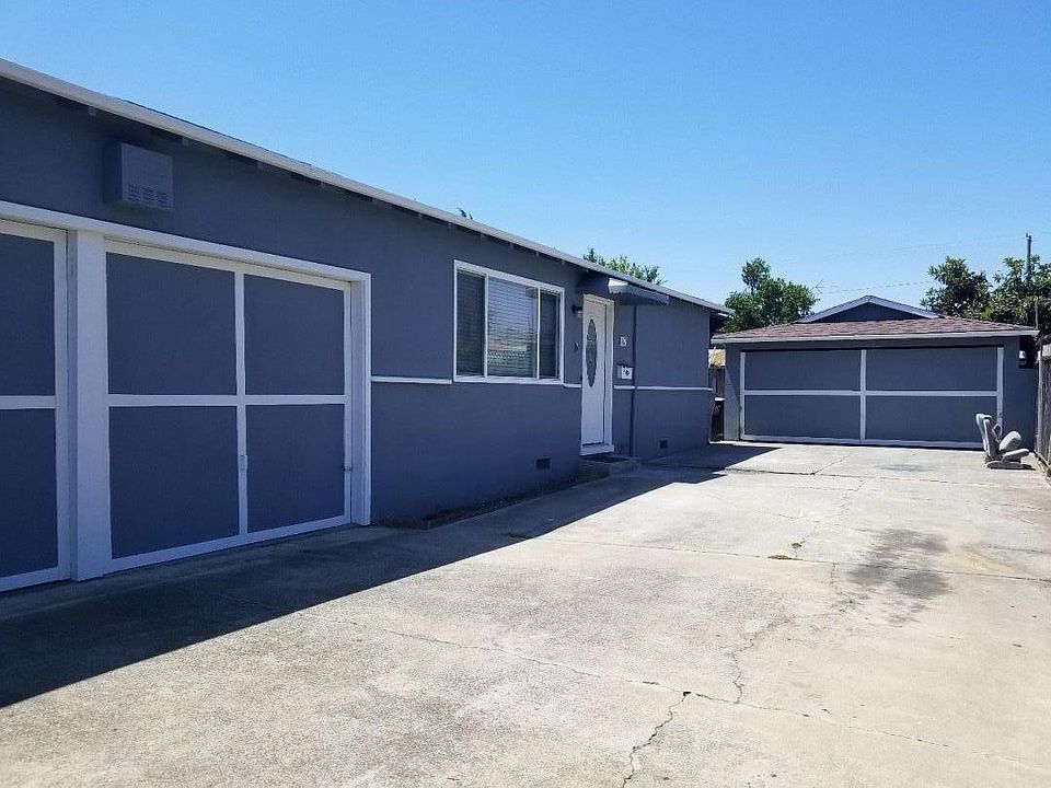 Driveway. One inside one-car garage can be used as an additional room. One detached two-car garage can be used for additional storage