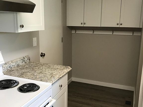 Similar kitchen/mud room layout. The unit for rent will have grey cabinets.