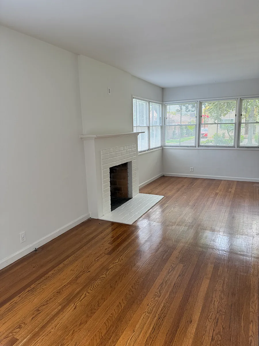 Living room freshly repainted and floors redone - 2746 Selby Ave