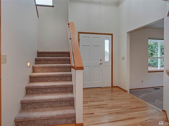 Main entrance has a closet on each side of this picture.  So much storage. Hardwood floors that have just been refinished and in perfect condition expand out into the kitchen and breakfast nook.