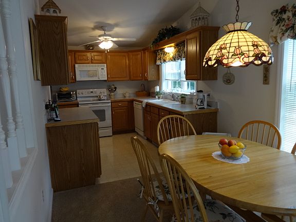 A large eat in kitchen with...