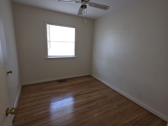 Bedroom 1, hardwood floors.