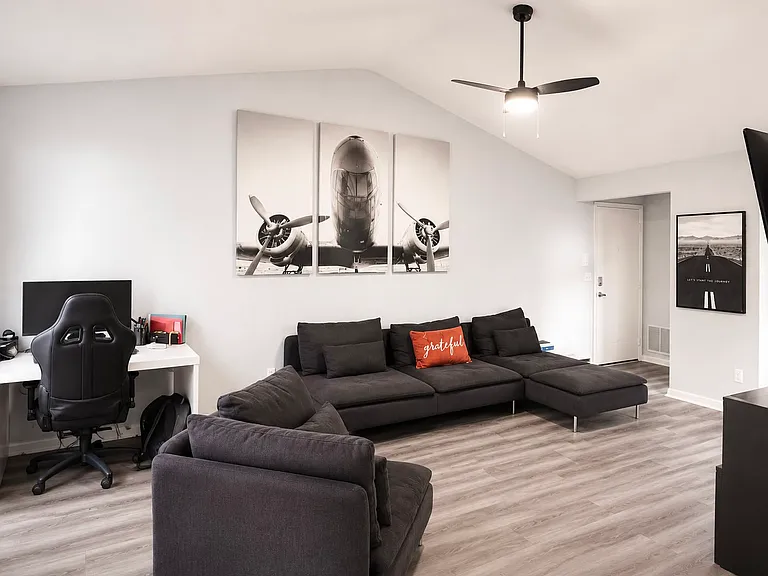 Bright and spacious living area with direct access to the screened balcony.