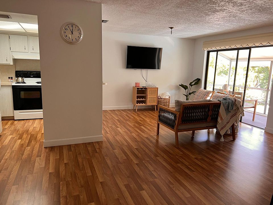 Open living/dining room Kitchen, and screened in balcony