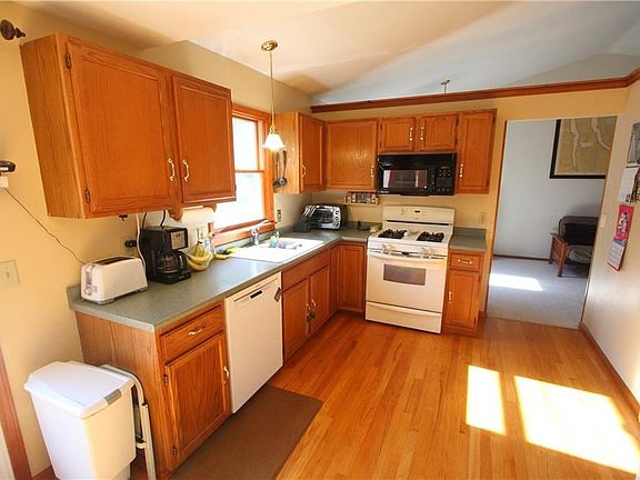 Kitchen is open and airy, with sliders to the backyard deck.