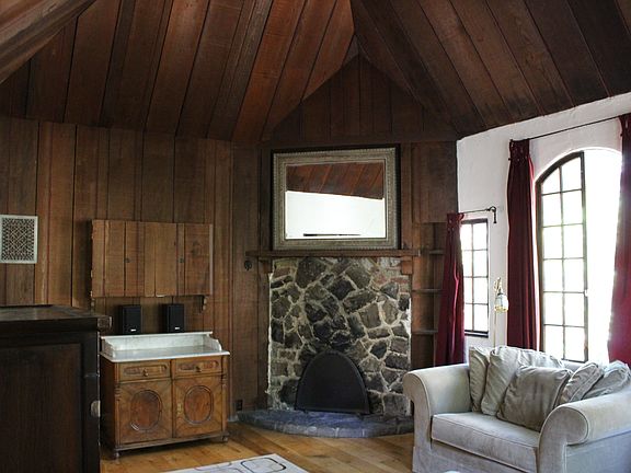 decorative fireplace, mirror, and mantel