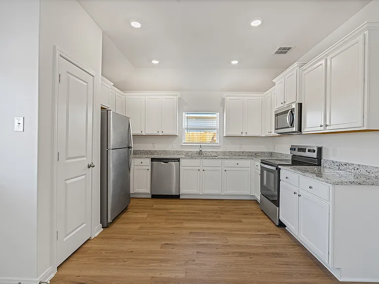 Kitchen with stainless steel appliances included.