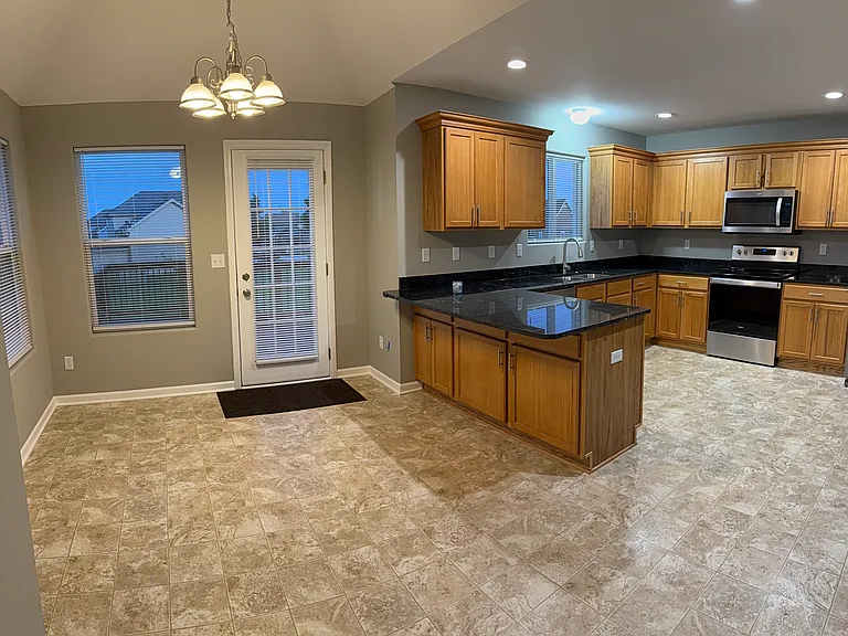 Large country kitchen with new granite countertop