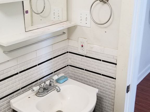 Bathroom sink. New subway tile in 2017.