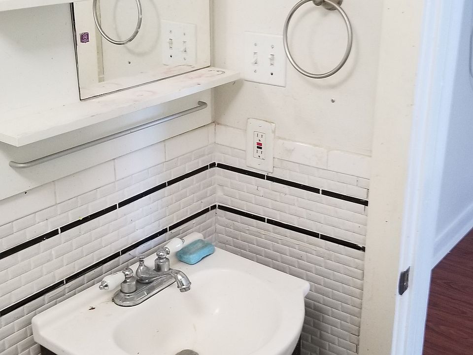 Bathroom sink. New subway tile in 2017.