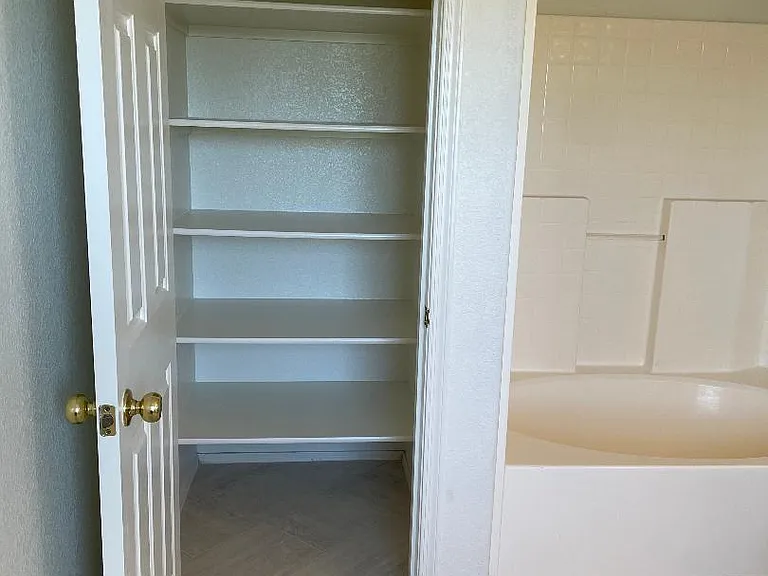 Generous Master Bath closet next to shower & tub