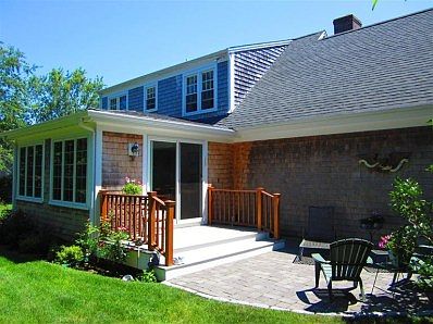 14' x 16' family room showing Azek deck and paver patio in backyard.