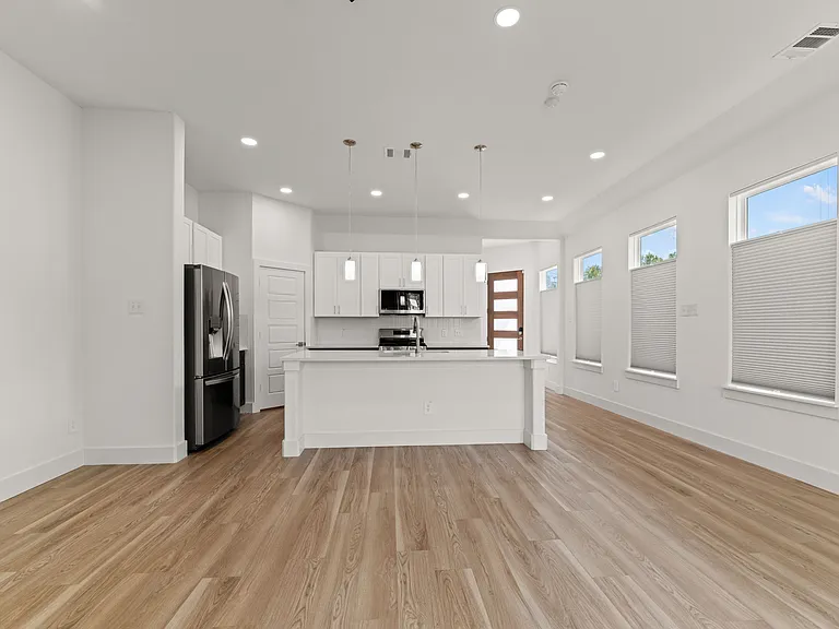 There are many lighting options in the kitchen and living room to provide the ambiance you desire. The 8' center island bar has room for 4 bar stools. The living/dining area is 15' x 19'