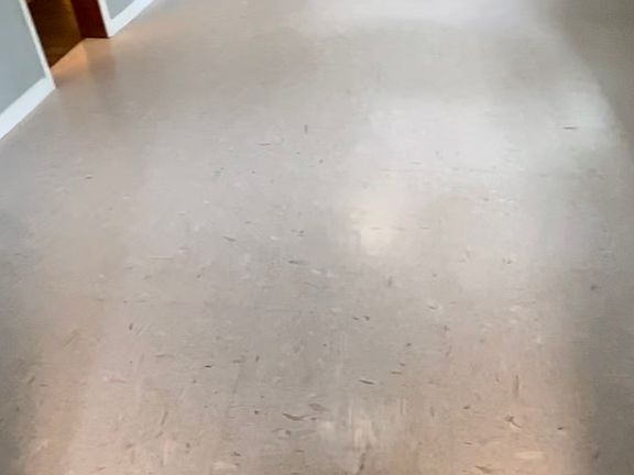 Livingroom floor is easy to clean, durable vinyl commercial tile.