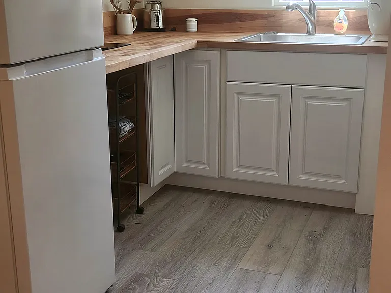 Small step up to 2 Burners no oven. Comes with New Apartment size Refrigerator as shown in picture.