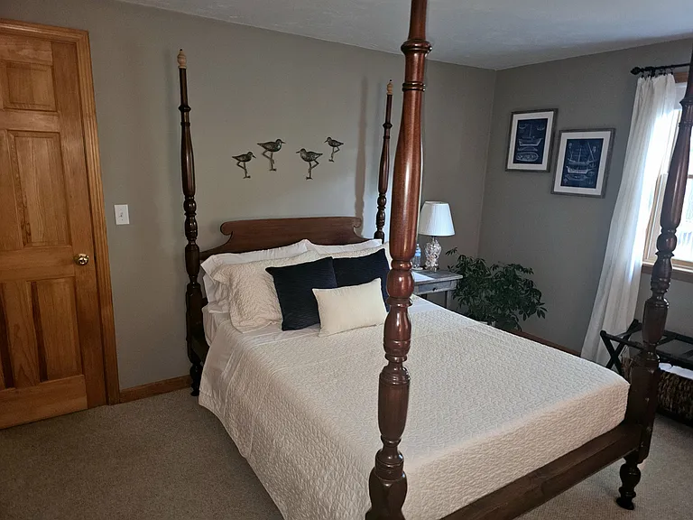 Beautiful vintage four_post and rail full_size bed paired with a comfortable memory_foam mattress.