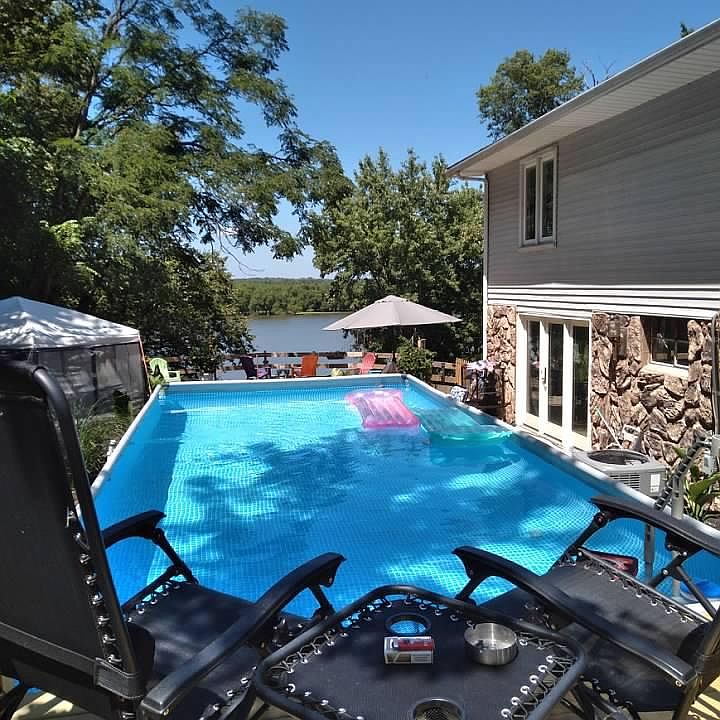 Backyard pool overlooking lake