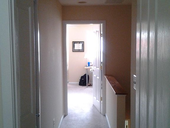 Hallway leading from bedroom 2 to master