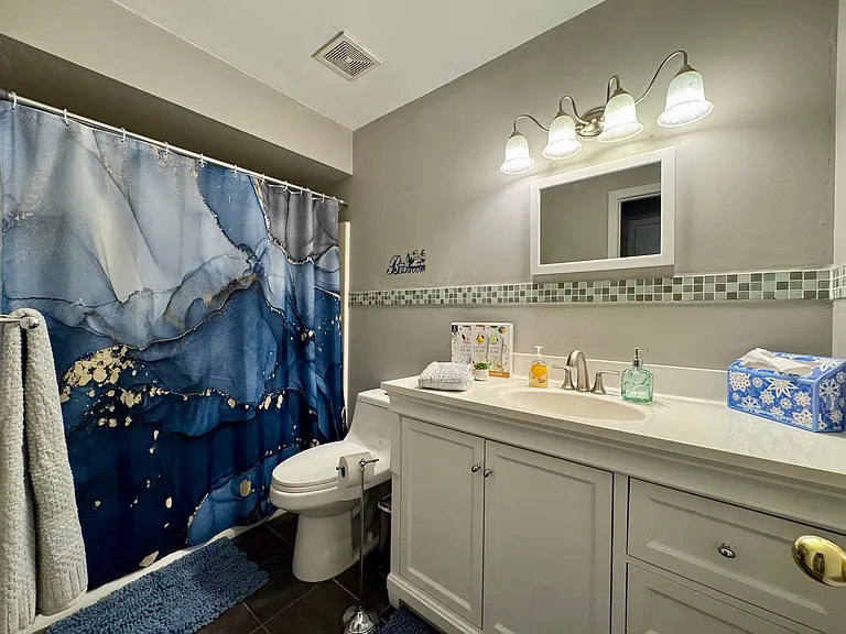 Full bath with shower, tile flooring