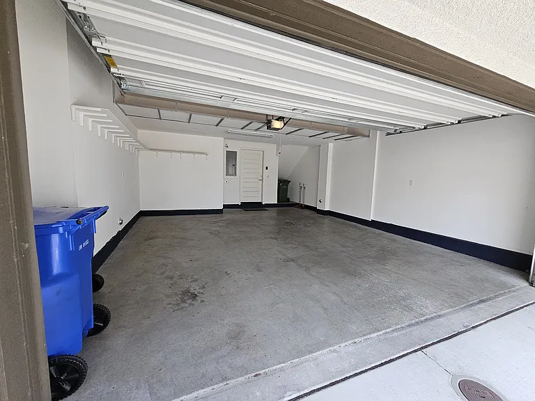 Large 2 car garage, very spacious, also have installed additional shelves on the side and on top for storage