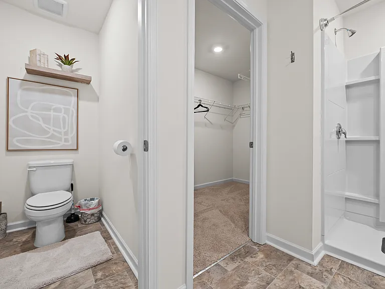 Master bathroom with walk in closet