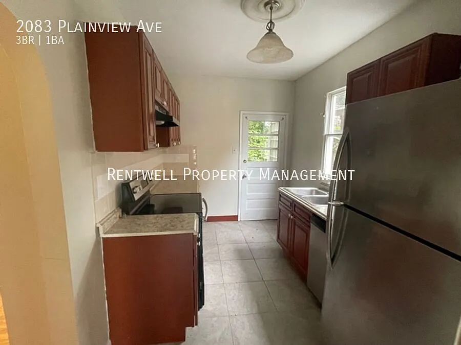 Beautifully Updated 3-Bedroom Home with Exposed Brick Fireplace — Photo 4