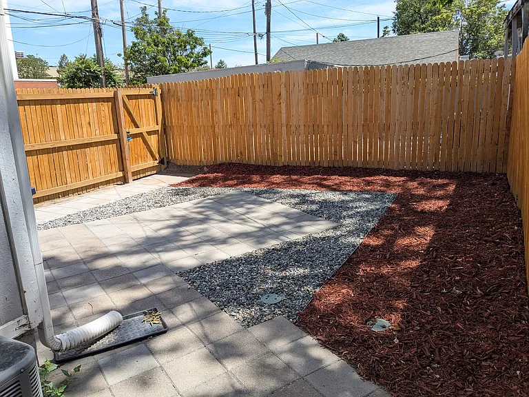 The fenced backyard accesses one dedicated off-street packing spot