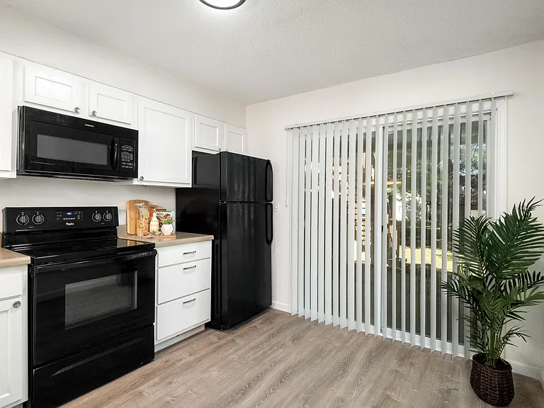 Kitchen looking out back patio door