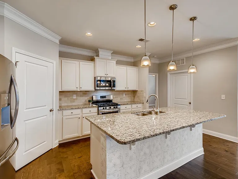 Stainless appliances including gas stove.