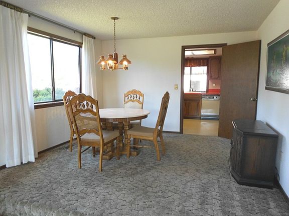 Kitchen with plenty of cupboard space and breakfast bar.