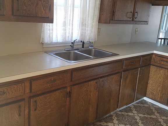 Double sink. Plenty of cabinet space and pantry..