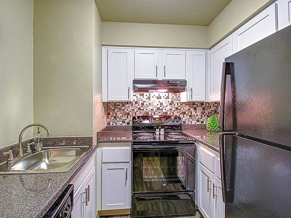 Experience culinary delight in this stylish kitchen, where form meets function.
