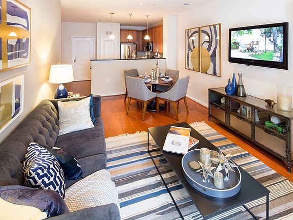 Living Room with wood-look flooring at Dwell Vienna Metro