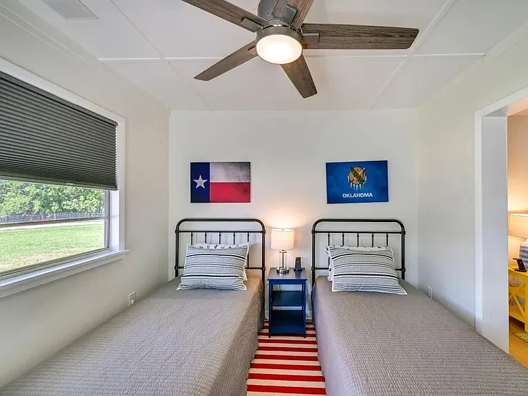 3rd bedroom off of Master. This room has 2 twins and doors to access the front parking area. No closet in this room.