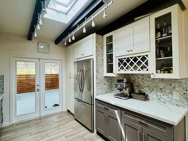 Kitchen view from living room to patio